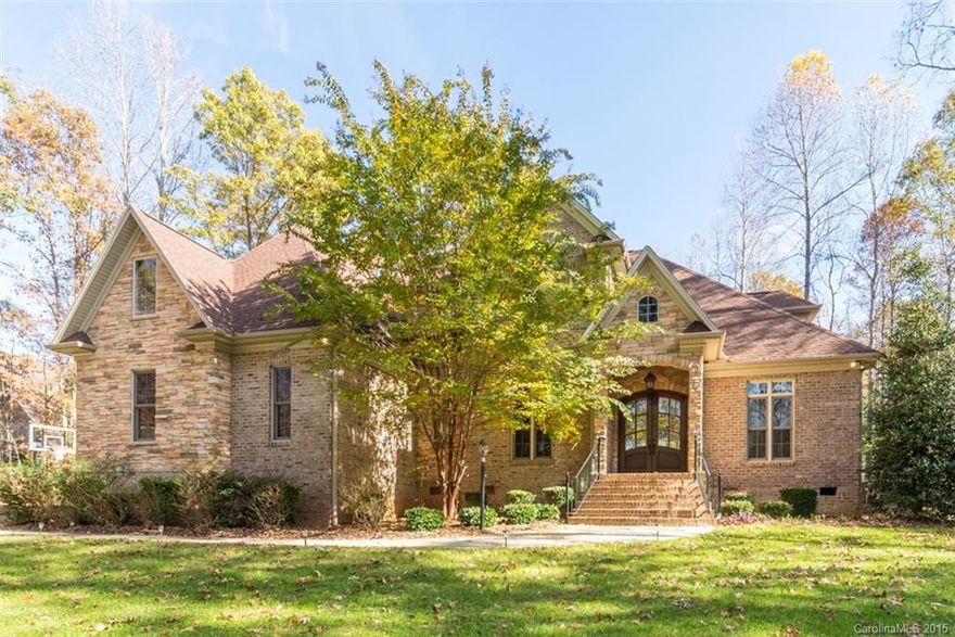 Gorgeous custom brick home in private setting. Rich Hardwoods,  Beautiful built-ins throughout. Dream Kitchen with SS appliances, granite. Butlers pantry, Luxurious master suite on main has a private deck and a sitting room with cozy fireplace. Fantastic Master Bath. Spacious secondary bedrooms, playroom and Rec room on second level. Large Covered Deck with fireplace overlooks patio and private backyard. Clover Schools. Low SC taxes.