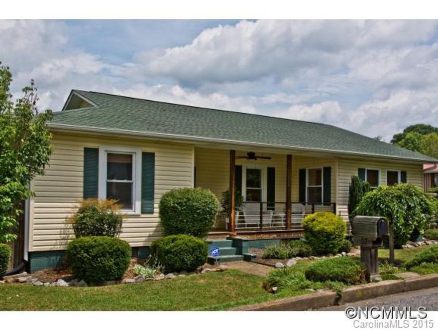 Mountains surround this classic bungalow.  Lovingly renovated to enhance the original beauty,  this warm, inviting home offers large rooms with 9' ceilings and gleaming hardwood flooring. Spacious MBR suite has walk-in closet & French doors opening to cozy side porch. Chefs kitchen has double oven, flat cook top lots of great cabinets, desk space.  Come sit & enjoy the sweet gardens & mtn. views. Garage, workshop, attic space..storage galore!