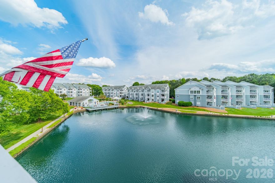You will love sitting on your 100 square foot (+/-) covered deck looking out over the large community pond with fountains and the community pool area, which is just close enough to easily enjoy it, but just far enough that you won't be worried about noise.  Stroll over to enjoy beautiful Lake Norman, and maybe even launch your kayak. Grab your racket for a quick game of tennis or pickleball. Feel like a quick bite and/or entertainment at a local restaurant / hot spot? - be there in about 3-5 minutes!  More in the mood for metro Charlotte? Hop on I-77, and be there in no time.  While you are here at home, you will truly appreciate the updated kitchen with GORGEOUS counters which provide plentiful work area plus space for additional seating. Electric range new in 2025, has downdraft, air fry, dehydrate, steam clean and bread proofing. Microwave also new in 2025.  The very nice electric fireplace isn't just for looks ... it also provides heat. Water and sewer included in HOA dues. No vacation rentals means this feels more like home, and protects your peace and your value.  Exterior was just painted Spril 2026. The HOA docs reference fiber cement, but seller isn't sure.  Photographer had to postpone, but we should have photos uploaded for you to see by Friday.  Stay tuned!