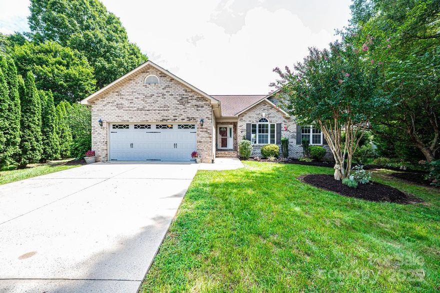 Welcome home to Colony Woods!  Sweet little neighborhood in NE Hickory, close to shopping, schools and restaurants.  Tucked away in a cul-de-sac, this all-brick home is ready to move into!  New paint throughout!  New HVAC 2024.  New covered porch addition 2024.  New flooring 2021.  Updated kitchen in 2020 with new cabinets, countertops and appliances.   Split bedroom plan separates the primary bedroom from the guest bedrooms.  Large Living room with gas fireplace.  The dining room is the perfect place to host special dinners for friends and family.  Love the large dining area that easily moves into the living room and around to the kitchen.  Spacious primary bedroom has a large walk in closet.  From the primary bedroom, step right into your new screened in porch with a ceiling fan and a flat screen TV that will stay!  There is something blooming year round in the yard.  Butterfly bushes.  Bulbs.  Camillas. Crepe myrtles.  A bird's paradise.  Come a take a look!