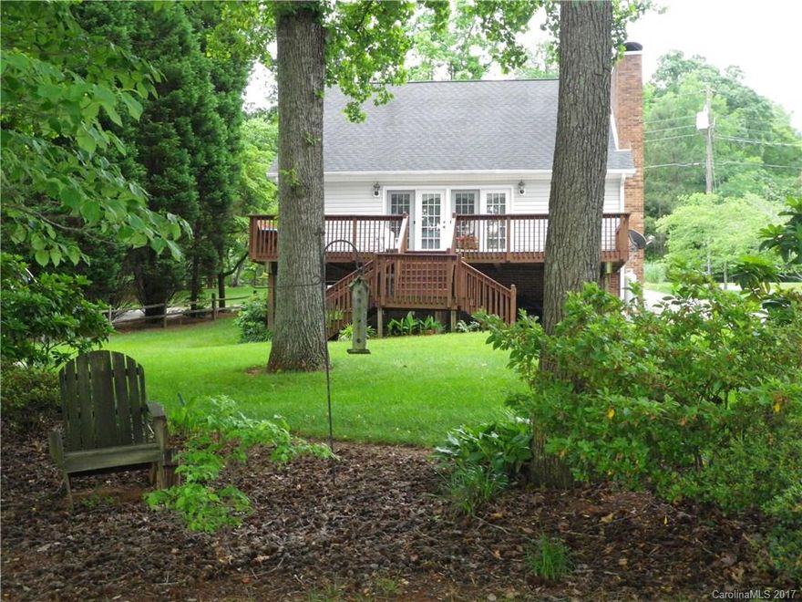 SUPERB WATERFRONT LOCATION WITH SUPER VIEWS, MATURE TREES & A GENTLE SLOPE TO THE LAKE! Located on main river w/approx 150ft of WF in the desirable Riverwood subdivision. Pvt pier has new floater w/composite decking & jet ski dock. Seawall, boat ramp & metal carport for boat storage! This sparkling clean saltbox offers 2BR plus 2 bonus rooms w/closets. Great room w/beautiful hardwoods & floor to ceiling gas log FP. Finished walk out bsmt offers extra space for guests, ½ bath & wood burning FP.