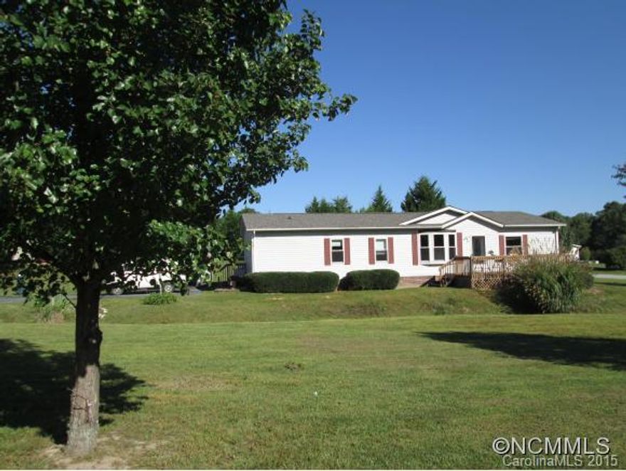 Country setting, but minutes to shopping and town. You will love this spacious home with split-bedroom plan, outstanding kitchen with center island and cupboards galore. Updates include roof in 2014, brand new wood flooring just installed throughout whole house, windows updated, heat pump replaced 2015, and freshly painted. Large backyard for play or plenty of space for gardening. Double carport with storage area. Be the first to see this gem!