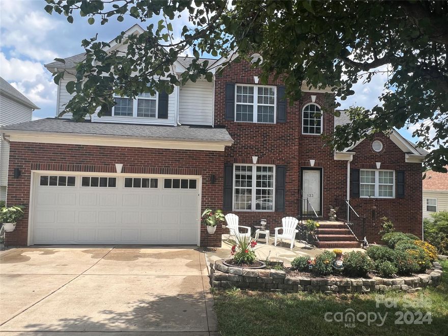 WOW! Priced to sell!  This amazing brick-front home features a two-story great room w/ a gas fireplace that flows into a spacious kitchen w/ granite countertops & butcher block center island. The main level boasts a luxurious primary bedroom w/ vaulted ceilings & an ensuite bathroom. Upstairs, you'll find 3 additional generously sized bedrooms. Enjoy the expansive yard w/ apple trees & raised beds for gardening. The home also includes a huge walk-in crawl space providing ample storage.

Key updates include an upper HVAC replaced 6/2020 (parts warranty until 2030) & downstairs unit replaced  8/2017, both installed by Bradham Brothers. Recent solar panels, installed in 2022, offer long-lasting savings on electricity.
Located in a sought-after neighborhood w/ amenities such as an outdoor pool, tennis courts, pickleball, clubhouse w/ a nearby restaurant & marina. Add your personal touches to make this home yours!