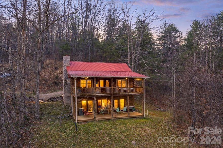 Welcome to your mountain cabin—whether you’re searching for a short-term rental, primary residence, or second home, you’ll be sure to appreciate the charm, comfort, and beautiful long-range views this property offers.

Built in 2005 and well maintained, this log cabin blends rustic character with functional living. The main level features an open-concept kitchen, dining, and living area filled with natural light, centered around a stunning fireplace that can be enjoyed from all three spaces. The primary bedroom and full bath are also conveniently located on the main level. Downstairs, you’ll find a second living area, two additional bedrooms, and a full bath, plus walk-out access—ideal for guests or maximizing rental potential.

Step outside onto multiple covered porches and decks, perfect for relaxing, entertaining, and taking in the mountain scenery. The home is being sold furnished (with some exceptions) and includes appliances such as washer and dryer, making it move-in or rental ready.

With a strong short-term rental history and a layout that works for both personal use and guests, this property offers flexibility and opportunity in one of Western North Carolina’s most sought-after settings.

Conveniently located between Asheville and Burnsville for easy access to dining, shopping, and outdoor recreation.