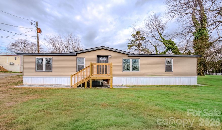 Beautifully remodeled 3 bedroom, 2 bathroom manufactured home with 1,440 square feet. Updates include a new roof, new HVAC system, and extensive interior renovations throughout. Situated on a 0.44 acre lot in a small neighborhood in Candler with additional land behind the home. Convenient location just off the main road with easy access to nearby local businesses, shopping, and dining.