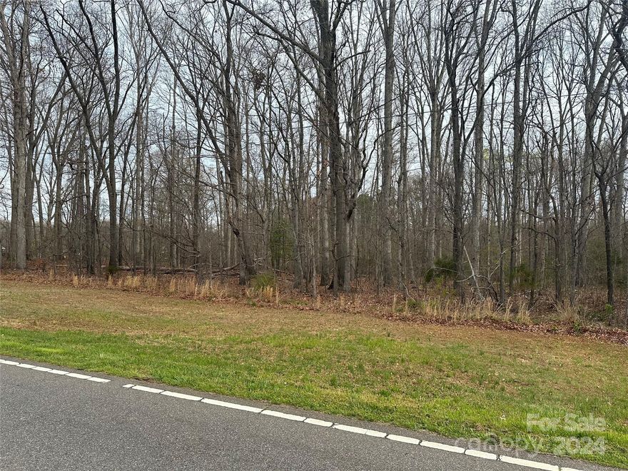 No restrictions! Come build your dream home on nearly 2 acres, just minutes from the heart of Harmony. Approximately 526 feet of road frontage on E Memorial Hwy. County water available at road - buyer responsible for obtaining information on hook-up and cost.