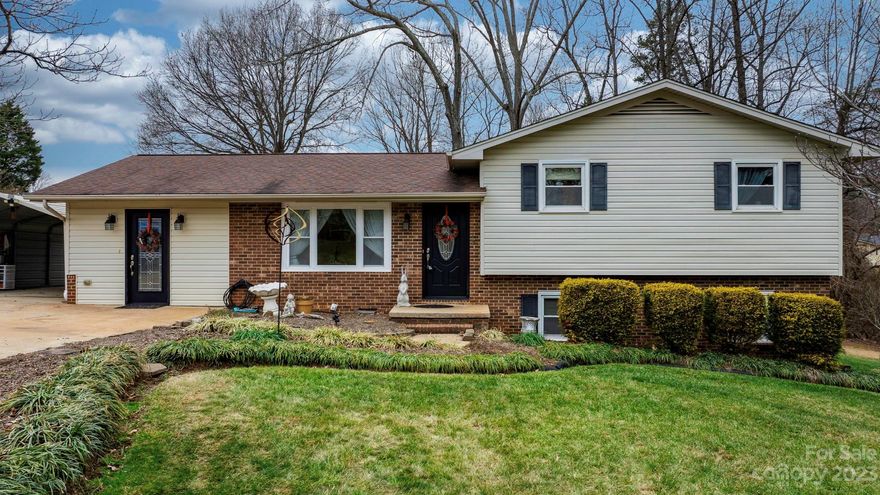 Step into simplicity and charm in this 3-bed, 1.5-bath Conover home.  The kitchen boasts custom wooden cabinets and a matching hutch, and the peninsula and counter height chairs add a touch of character and practicality. The versatile dining/flex room adapts to your needs, whether it's family meals or additional living space. Choose between a gas or wood stove fireplace in the downstairs den for warmth and ambiance. Walk out from the den onto the patio to enjoy a well-maintained, fenced yard . Also downstairs is a large room perfect for a home office. On the upper level, you'll find 3 bedrooms and one bathroom with double sink vanity plus plenty of closet storage. Don't miss this charming Conover residence!