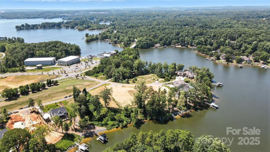 Spectacular waterfront property in highly sought-after McLean Hunts Point community. This gorgeous, .79-acre  gently sloping lot is the perfect canvas for building the forever home of your dreams. Imagine waking up feeling like you're on vacation every single day, gazing out at picturesque lake views right in your backyard. This prime lot is nestled on a tranquil cove, making it ideal for swimming and fishing, while also offering quick, effortless access to the main channel for all your boating & water sports adventures. Enjoy unparalleled convenience w/ easy access to the scenic Carolina Thread Trail, featuring paved entry directly from Hunts Point. You're just moments away from the Drift restaurant on Lake Wylie and Stowe Botanical Gardens.  Embrace the charm of beautiful Belmont, a town that blends a small-town feel w/ being incredibly convenient to uptown Charlotte, shopping, dining & airport.