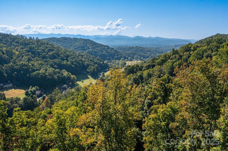 This upward-sloping lot offers a homesite perched above the road, providing added privacy and seasonal winter views. The driveway has already been graded, and trees have been cleared from the homesite, making it easier to prepare for building. Located in the gated Mountain Park community, residents enjoy paved roads, high speed internet and access to a clubhouse and tennis courts. The neighborhood is convenient to Mars Hill and just minutes from I-26, offering easy access to Asheville and the surrounding areas.
