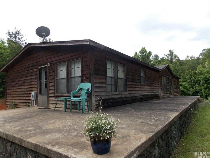 MOTIVATED SELLER!  Lots of room and ready to move in home with 2 acres,  3 bedrooms 2 bath, fireplace, huge kitchen with island, large master suite with large bath, several walk in closets, huge wrap around porch, outbuilding for storage, outdoor firepit, no city taxes, if you love the country you will love this home, country setting yet close to schools, I-40 and shopping