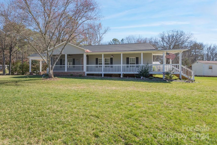 This newer home with two bedrooms and two bathrooms has many great features and is ready to welcome new owners.  The beautiful, open kitchen with white cabinets, stainless steel appliances, farm sink, and granite countertops overlooks the spacious family room and dining area.  The primary bedroom features a private bath with custom tile shower.  The laundry room is large and provides space for an office, if needed, or can be used for a variety of uses.  Enjoy the early mornings or evenings relaxing on the screened porch or on the “rocking chair” deck across the front of the home.  In addition, there is a second deck on the back.  Needing extra storage?  You must see the fabulous, detached, building that can be used for many purposes.  Located on a corner large lot, you will be impressed when you walk through this one!