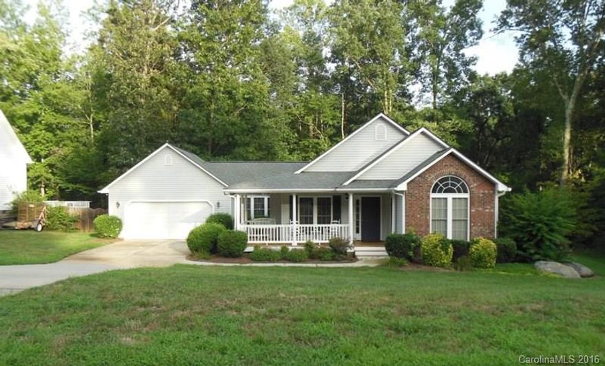 Southern charm best describes this home with its warp around front porch and a paved secret garden path in the backyard. The backyard backs to woods with no other homes visible plus there's a deck too. Another special feature about this home is the large flex room off the kitchen that could be used for anything from an additional family room, playroom, gym. The list of uses is endless.