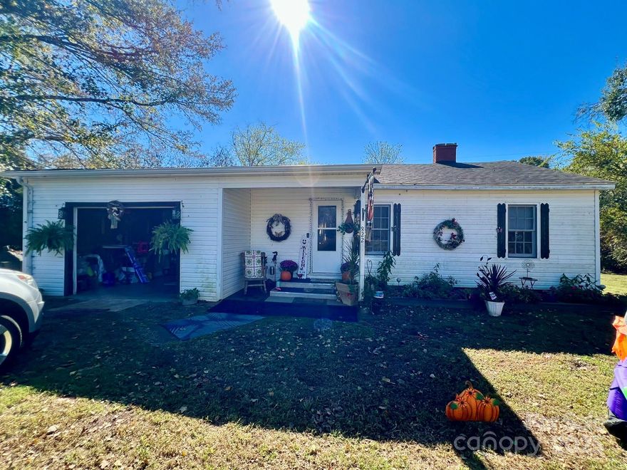 Discover this inviting 1950-built home nestled in a peaceful rural setting. Surrounded by trees and open fields, it offers a serene backdrop with a level yard and a cozy covered front porch — perfect for relaxing outdoors.

Inside, you’ll find a generous open kitchen and dining area, two spacious bedrooms, and one full bath. The home also features a one-car garage for covered parking and a small garden area in the backyard.

Ideal for investors, first-time buyers, or those looking to downsize, this property combines comfort and potential.