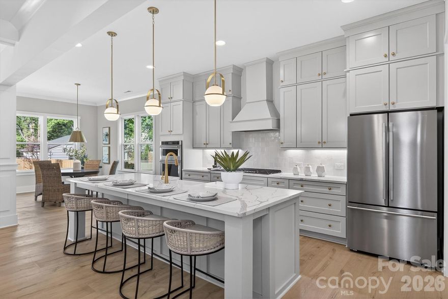 $155k reduction!! Rare opportunity to own the LOWEST-PRICED new construction home over 4,100 sqft within 10 miles of Uptown Charlotte. This home delivers true luxury at a price point that’s becoming increasingly hard to find this close to the city. For buyers focused on value, location, and long-term upside, Oakhurst continues to stand out as one of Charlotte’s most promising neighborhoods, offering close-in convenience with strong future appreciation potential as redevelopment continues to accelerate. Just minutes from Uptown, Cotswold, and Plaza Midwood, this location is ideal for families who want quick access to Charlotte’s top private schools, daily commuting ease, and the ability to enjoy the city’s energy without paying legacy neighborhood premiums. Even better, you can walk to nearby restaurants, coffee shop, and a community garden making everyday life both convenient and connected. This home has a bright, open-concept layout designed for modern family living. The gourmet kitchen is the centerpiece, complete with an oversized island, walk in pantry, and custom cabinetry, all flowing seamlessly into the main living and dining areas—perfect for entertaining. The spacious primary suite offers a private retreat with a spa-like bath, freestanding tub, and glass-enclosed shower. Generous secondary bedrooms, flexible office or guest spaces, and laundry rooms on both levels provide functionality for busy households, while a large bonus/loft area creates the perfect space for a playroom or media room. High-end finishes include wide-plank flooring, designer lighting, and abundant natural light throughout. Covered front and rear porches extend the living space outdoors, overlooking a private backyard ready to be customized. For buyers seeking luxury, space, and smart value in an up-and-coming area, this home checks every box—offering a chance to get into a high-growth neighborhood early while enjoying a level of quality and square footage that would command a significantly higher price closer to the city core.