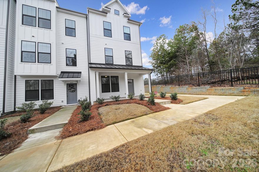 Discover luxury living in this brand-new (less than 1 year old) end-unit 4-bedroom townhome in the heart of Baxter Village. Featuring a 2-car garage and upscale finishes throughout including quartz countertops, LVP flooring and remote controlled shades in the kitchen. This home also includes a refrigerator, washer, and dryer that convey. Enjoy a true walkable lifestyle with shops, restaurants, a gym, hiking and biking trails, tennis courts, pools, and community events like music in the park just steps away. Ideally located with easy access to the airport and less than 30 minutes to uptown Charlotte, this is elevated living at its finest. This property is still under all the builders warranties.