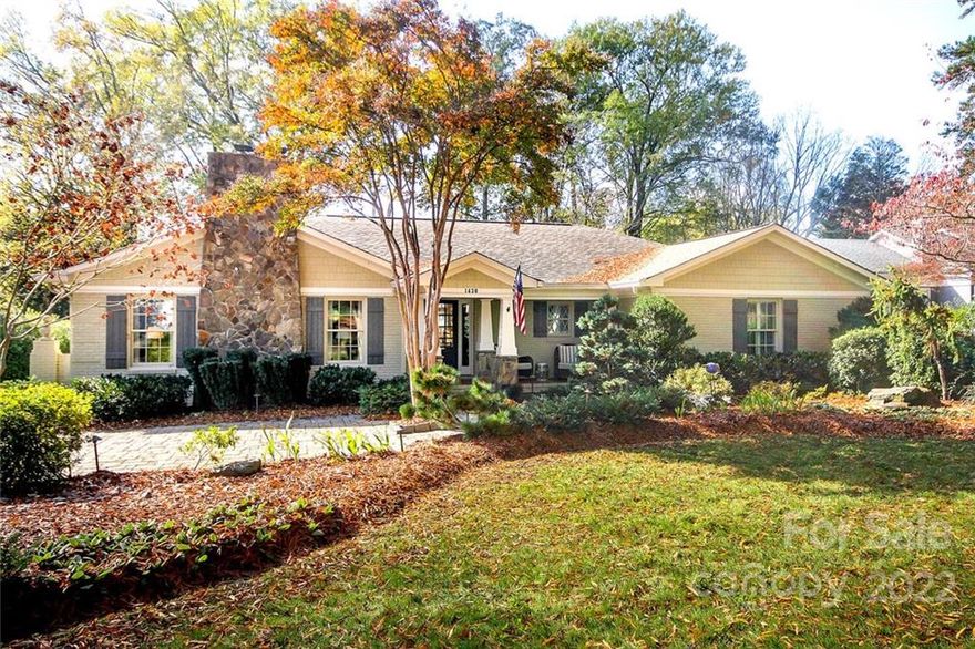 Gracious brick ranch right in the heart of Eastover! Inviting front porch welcomes you to this elegant home with bright and open spaces ideal for easy entertaining and everyday living. Many rooms have raised ceilings adding gorgeous architectural detail. Spacious family room with gas fireplace flanked by built-ins opens to gourmet kitchen with butcher block top island, quartz countertops, gas cooktop, Subzero refrigerator and walk-in pantry. Primary bedroom with access to the back terrace, large bath with shower and separate tub, walk-in closet. 3 additional generously sized bedrooms. The backyard feels like a private retreat with lush landscaping, tranquil water fountain and beautiful stone patio. There’s even a putting green. Detached garage with storage/work room and attached shed. Above the garage is a one-of-a kind bonus room with a stunning beam ceiling, full bath that would make a great bonus room, office or guest suite. So much flexibility and perfect for all stages of life!