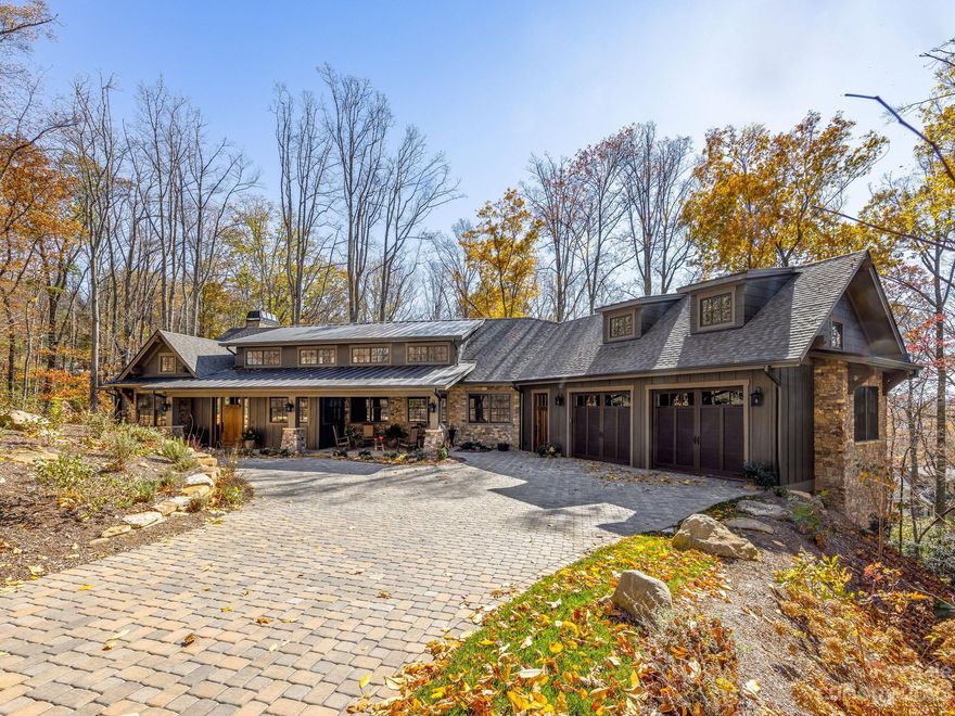 One-of-a-kind Luxury Custom Home in beautiful Southcliff! Come delight in this recently completed Modern Craftsman style home where every detail has been carefully planned for space and function, allowing the design, architecture and setting to be unmatched! There is a luxurious primary on the main and two additional primary w/ensuite and a fourth bedroom/study/art room. Magnificent open floor plan with soaring ceilings complimented by warm wood accents, large windows, pecan floors, 8' doors, cathedral windows and two, floor to ceiling fireplaces make this home perfect for entertaining. Chefs kitchen with knotty alder cabinetry, large island and butlers pantry is a culinary arts dream! Enjoy multiple outdoor spaces including a three season porch, an upper and lower deck, a stone fire pit patio and front of the home portico entertaining patio, allowing for mountain living at its finest. Come see  one of Asheville's finest luxury homes combining ease of living and exceptional quality.