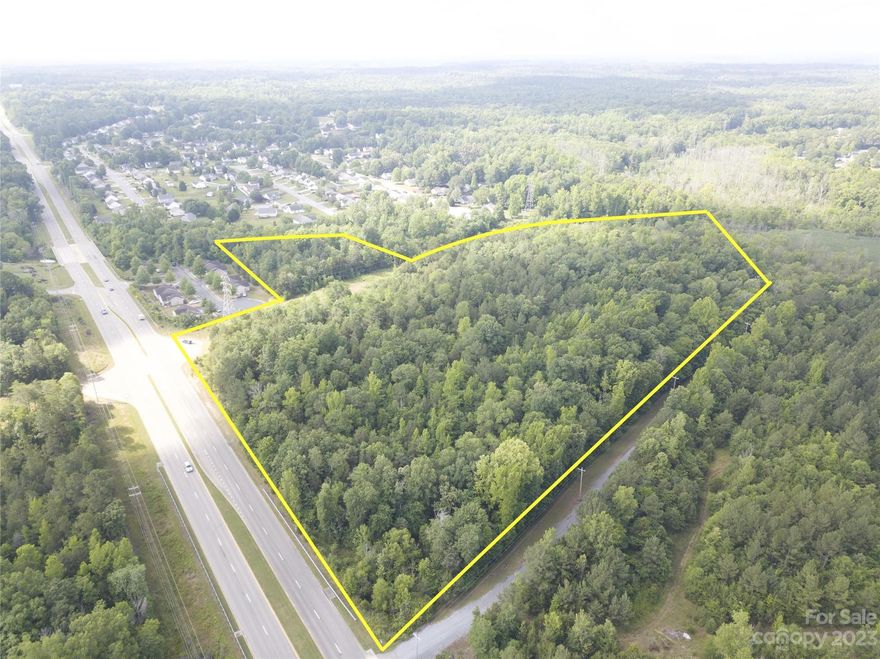 Located on Mt Holly Rd, this property boasts an impressive 600 feet of road frontage and is conveniently situated only 4 minutes away from I-77 and a mere 30 minutes from the vibrant city of Charlotte. Public water and Sewer available. Zoned SF-3.  While the property's perimeter falls within a flood zone, this doesn't diminish its potential. With its prime location, this land presents the perfect canvas for development or investment purposes.

Buyers are encouraged to confirm the zoning rules and regulations independently.