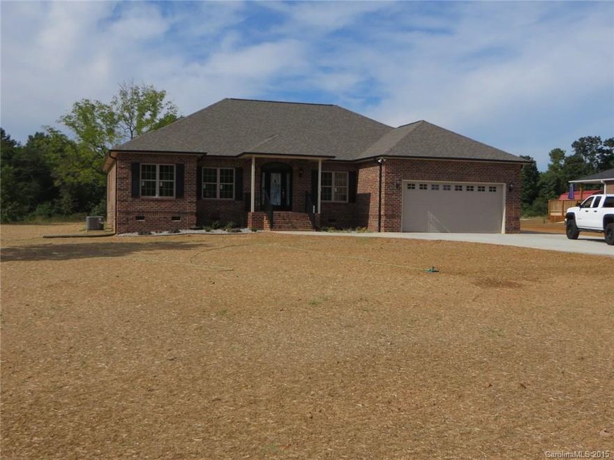 New Construction in North Lincoln School District!  Brick home w/3 Bedrooms & 3 baths, Den w/fireplace & entrance to Rear Lanai w/”Easy Breeze” system with open screens or closed sides for winter.  Kitchen offers granite counters, stainless appliances, oversized work-island, pantry has appliance counter to free kitchen counter space. Master suite w/tray ceiling, garden tub, dual vanity & walk-in closet. Vaulted & tray ceilings, wood & natural stone floors throughout.  This is a must see!