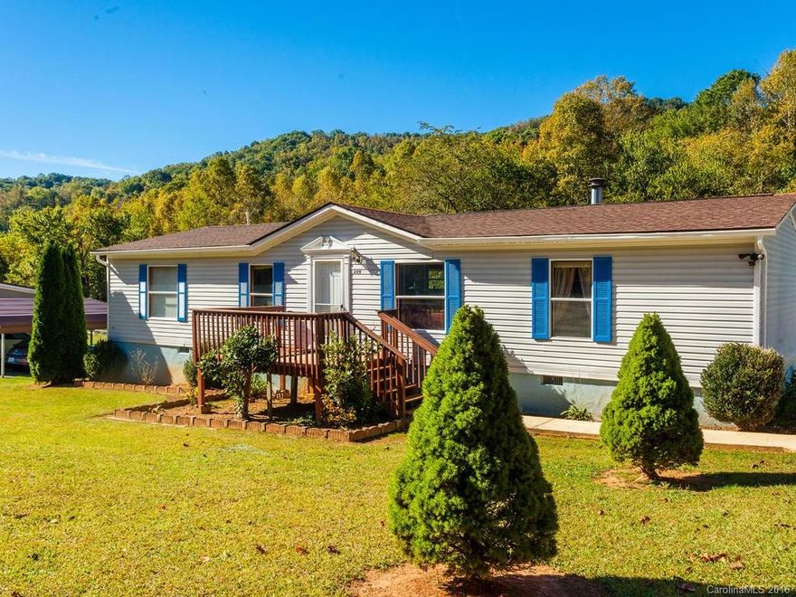 OPEN FLOOR PLAN and MOVE-IN READY on a half acre that backs up to a creek!! If you're looking for a well-maintained home on a sweet piece of USABLE land, this is it! Enjoy the mountains through the seasons. Yard is great for gardening, pets, kids and kids at heart. Remodeled bathrooms and kitchen include granite counters and stainless appliances. Spa-like MA BA has huge walk-in shower with tile surround. Cozy up to the wood-burning fireplace or relax on the covered back porch.  Come see!