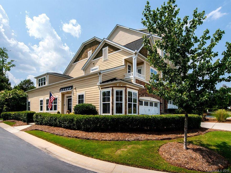 Former Model Home in Tega Cay within walking distance to Lake Wylie & Tega Cay's beach club. Luxury features include plantation shutters, central vac, hardwoods throughout main living areas, tile floors & granite counters in baths, intercom. Gourmet kitchen has designer cabinets, undercab lighting, SS appliances. 2 story great room features a stacked stone FP, builtin cabinets, & surround sound. Owner's suite w dual vanity, garden tub, walkin. Huge bedrooms & loft. Private outdoor living area.