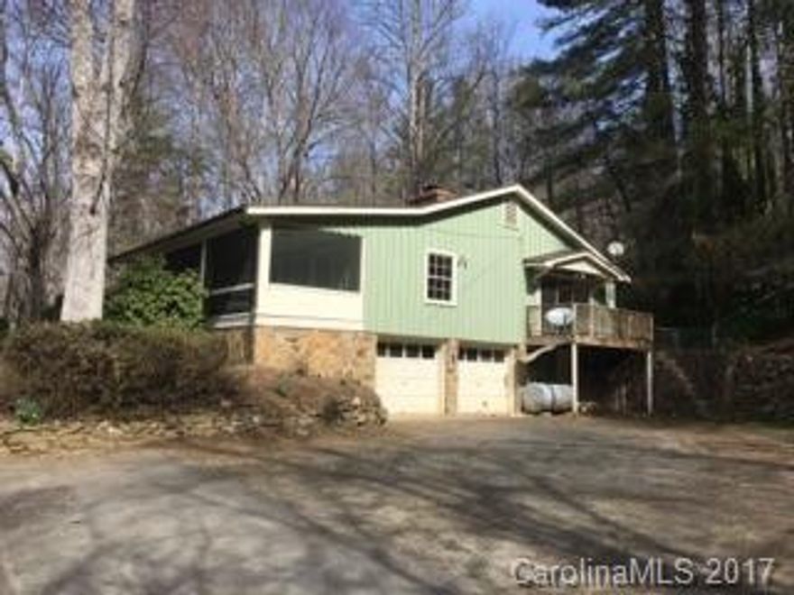 Just a couple miles from WCU - 1 level living 3 large bedrooms, 2 baths, huge living room, built-in through out, new counter tops, all hardwood floors, HVAC, Radiators, DSL avail, garage basement, full length covered screened porch, fenced back yard and small stream all on 5.9 private acres.