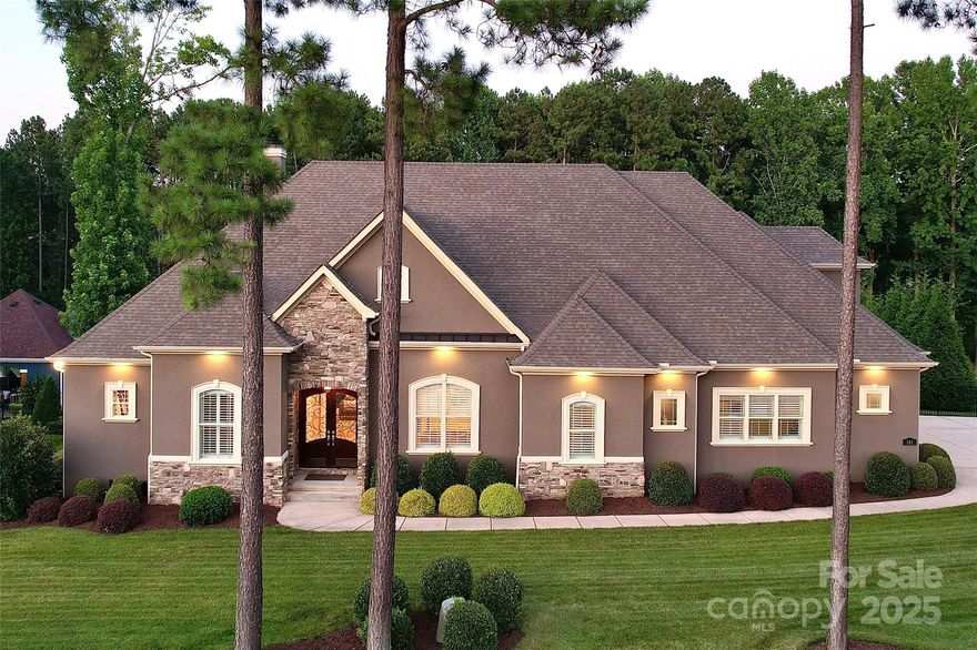 Experience elevated living in this custom-built retreat, designed for comfort & exceptional entertaining. Located near Lake Norman, this thoughtfully crafted home blends elegant design & functional living. The open layout features wide-plank hardwoods, coffered ceilings, & a striking fireplace anchoring the great room. A chef’s kitchen offers dual marble islands, walk-in pantry, & seamless flow to the formal dining room & breakfast area.

Main level includes primary suite w/ oversized custom walk-in closet, 2 guest suites w/ full baths, private office, secondary living/bonus rm, & full bath w/ exterior access for pool guests.

Upstairs features 2 spacious bedrooms, a shared full bath, & access to an unfinished walk-in attic (500+ sqft) w/ potential for media, gym, or flex space.  

Step outside to your private resort: covered patio w/ fireplace & TV area, custom pool w/ built-in spa, pavilion, outdoor kitchen & grill, & a flat, fenced backyard perfect for year-round enjoyment.