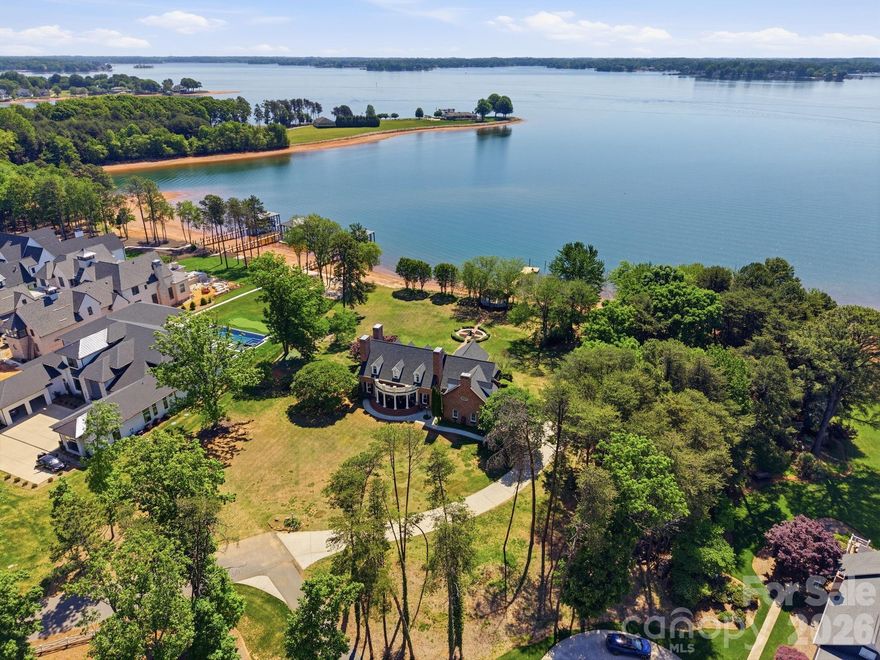 Don’t miss this rare opportunity to own a stunning piece of Lake Norman history. Cherished by the same family since before the lake’s creation, this full-brick Southern Living home sits on 1.44 acres with over 400 feet of pristine shoreline and some of the most expansive views on Lake Norman. Located in the prestigious Saylor’s Watch community—without the HOA dues or restrictions—this exceptional property offers a large, level lot complete with a lakeside gazebo and fire pit. Perfect for entertaining, it has even hosted numerous unforgettable waterfront weddings.  Rich in Southern charm, the home welcomes you with a classic front porch and opens to a spacious terrace overlooking the water. Inside, you’ll find unique artistic touches and distinctive details throughout, including a hand-painted dining room mural by the artist/owner, antique light fixtures, French doors, custom built-ins, and a generously sized kitchen designed for family gatherings. The main level features a serene lakeside primary suite with a luxurious bath and direct terrace access, along with a light-filled living room showcasing a wall of windows and a cozy fireplace. A private office or den with its own fireplace offers the perfect work-from-home retreat. In total, the home boasts three fireplaces, including one in the formal dining room. 
Upstairs, you’ll find three additional bedrooms, a spacious bonus room, and an enormous unfinished area offering endless possibilities for expansion. With unmatched waterfrontage, room to grow, and timeless character, this is truly a one-of-a-kind offering. Schedule your private tour today.