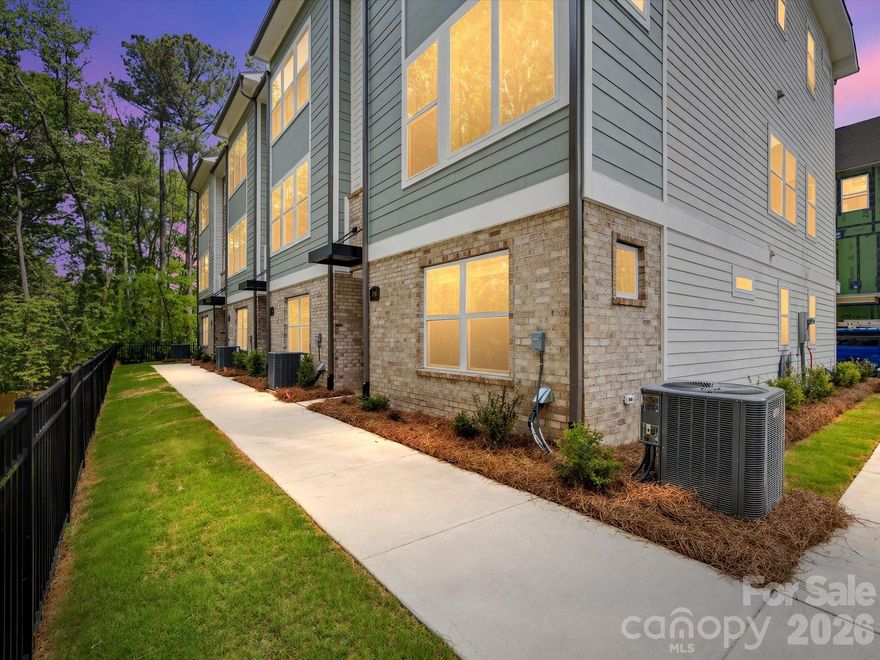 Tucked along a peaceful treeline, this three-story end-unit townhome by David Weekley Homes perfectly combines modern design, energy efficiency, and natural serenity. Featuring three bedrooms and three-and-a-half baths, this beautifully crafted home offers a bright and open floor plan with 9-foot ceilings, large windows, and elegant Shaw LVP flooring that enhance its inviting atmosphere.
The chef’s kitchen is both stylish and functional, showcasing granite countertops, 42-inch cabinets, and a spacious island—perfect for entertaining or enjoying everyday meals. Step out onto your private balcony to take in tranquil treescape views, offering a relaxing retreat right at home.
Upstairs, the primary suite impresses with a large walk-in closet and a luxurious en-suite bath. Built with EFL Certified construction, this home delivers long-lasting comfort and energy efficiency to help reduce utility costs.
Stylish, efficient, and surrounded by natural beauty, this home in Central Living at Craig truly has it all.