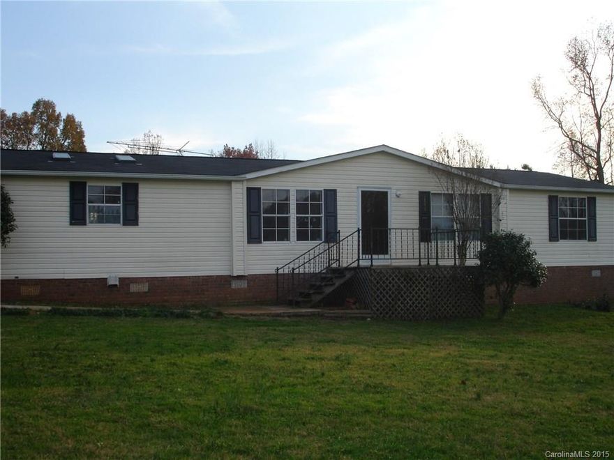 MAY I HAVE YOUR ATTENTION PLEASE!!! Are you looking for land to hold your livestock, then this is the perfect place! Farming paradise at an extraordinary price!! All 5 acres fenced in, equipped with a 4 stall horse barn with a tack room. 3 bedroom, 2 bath with attached garage.