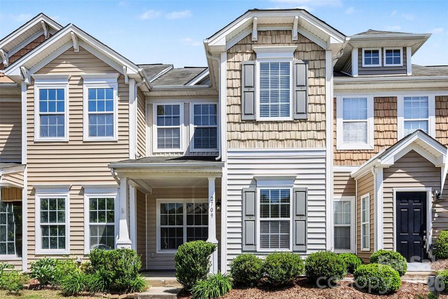 Welcome to this beautifully maintained townhome in the desirable Cedar Mill community, where comfort, style, and convenience come together seamlessly. From the moment you arrive, the charming exterior and inviting front porch set the tone for what’s inside. Step into a bright, open main level featuring warm wood flooring, a spacious living area centered around a cozy fireplace, and a thoughtfully designed layout that flows effortlessly into the dining space and kitchen—perfect for both everyday living and entertaining.
Natural light fills the home, including a sunroom-style space at the rear that opens to a private patio—an ideal spot for morning coffee or unwinding in the evening with a bit of outdoor privacy. The kitchen offers ample counter space and a functional layout that connects easily to the main living areas, making it as practical as it is welcoming.
Upstairs, you’ll find two generously sized bedrooms, each with its own private en-suite bath, creating a comfortable and versatile setup for guests, roommates, or a dedicated home office arrangement. The laundry is conveniently located on the upper level, adding to the home’s thoughtful design. A newer HVAC system provides added peace of mind and efficiency.
Cedar Mill offers a lifestyle that extends beyond your front door, with access to a community clubhouse, fitness center, outdoor pool, playground, and sidewalks perfect for enjoying the neighborhood atmosphere . The surrounding area places you just minutes from shopping, dining, and everyday conveniences, with easy access to major roadways for a smooth commute into Charlotte and beyond.
This is an excellent opportunity to enjoy low-maintenance living in a well-kept community with amenities that enhance your day-to-day life, all in a location that keeps you connected to everything you need.