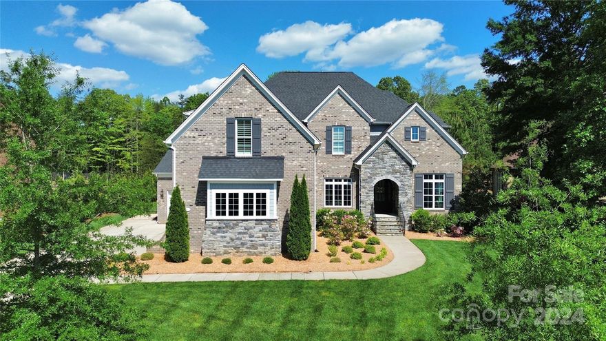 Gorgeous Custom Home In Gated Waxhaw Neighborhood. Double Wood & Glass Doors Welcome You, As You Step Inside Greeted By An Abundance Of Natural Light Filling Each Space.  Open & Airy With An Elegant Flow. Gourmet Kitchen With Rare Granite Accenting The Dine-In Island, Custom Cabinetry With Quartz Tops And Herringbone Backsplash. Lovely Dining, Den, Breakfast & Great Room With A Stunning Stone Stacked Fireplace. Upstairs Features A Spacious Primary Suite With Luxurious Bath & Walk-In Closet. 3 Additional Bedrooms & Vast Bonus With 4K Projector. Fifth Bedroom Down. The Show Stopper Of This Home Is The Private Backyard Oasis Drenched In Lushness With An Exquisite Zero Entry Heated Salt Water Pool & Hot Tub, Surrounded By Travertine Pool Decking And Covered Patio.  Mature Landscaping & Emerald Zoysia Lawn. Additional Features: Drop Zone, 5" Plantation Shutters, Chic Decorator Lighting, And 4 Car Garage. Top Rated Schools & Minutes From Shops, Dining & So Much More.  Shows Like A Model.