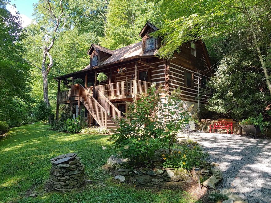 Gorgeous 3BR/3BA chinked log home with additional parcel in highly desirable Fairview, NC. Beautiful forest setting with great mountain views in the winter, flowering rhododendron in the summer, and the sound of a nearby stream year round….yet minutes to everything. The sellers have spared no expense in updating this beautiful property. Newly paved road and driveway to house for easy access.  A partial list of improvements since 2019 includes four mini-splits, a new gas log fireplace kit, new kitchen cabinets, new rear deck and hot tub, new flooring and walls in the master BR, new front staircase, new radon mitigation system, and new windows throughout. The lower level was completely finished off, with the addition of a new full bath, new laundry room, new flooring and a game room addition. There is a FOURTH sleeping area in the basement. Home is currently set up as a successful, full-time vacation rental but would make a great primary residence or vacation home. Buyers will have the opportunity to purchase this as a turnkey, low maintenance rental property.  Located just minutes to grocery store, post office, dining and two popular breweries....and only 20 minutes to Asheville.  This home checks all of the boxes!