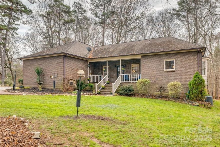 Those that love privacy, a superior-built home and the charm of southern living prepare to be impressed! Lots of extras in this custom-built, brick home being offered by original owner. Need a separate living space? The walk-out basement level comes w/ a living area, wood-burning fp, two bedrooms, two full baths and kitchenette-sink in place, easily add cooking surface & fridge. The woodworker or car enthusiast will enjoy a wired 16’x32’ brick workshop. Looking for a quiet place to relax--choose from the screened porch, cedar-lined sauna, solarium or sunroom. Better than a firepit, the fully screened gazebo has a wood burning fp, perfect for large gatherings in all seasons. Also offered on this amazing 7.39 acre wooded homesite, a winding driveway reveals an abundance of fruit trees, grassy areas and still plenty of room for an in-ground pool or gardens. This home even includes rare finds like a treehouse & wine cellar. No HOA, great Union County Schools. Come discover it today!