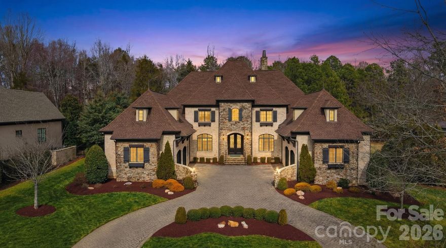 Presenting an exquisitely appointed and majestic French Manor home nestled in the prestigious community of Skyecroft. This remarkable home has been extensively updated and thoughtfully modernized, seamlessly blending desirability and functionality with the timeless character and architectural charm that define its original design.
The exceptional floor plan offers a refined balance of grand entertaining spaces and elegantly proportioned rooms. At the heart of the home, a stunning chef’s kitchen that flows effortlessly into a dramatic two-story family room, with a stone fireplace and gorgeous wooden beams. Designed for both intimate gatherings and large-scale entertaining, the home features multiple living and entertaining areas across two levels, providing versatility and distinction at every turn. Custom-crafted built-ins, 3 regal fireplaces, a game room, a loft, a movie theater, 2 wet bars, a formal dining room, a jaw dropping custom office that feels elegant while equally inviting-  meticulous attention to detail is found throughout. The main-level primary suite is a true retreat, showcasing a European stone fireplace, hardwood floors, lots of natural light, plus an extraordinary dual-entry shower with multiple jets, and a primary closet so expansive and custom that you must see it to believe it! The attic also offers an opportunity for an additional bedroom to be added and yet still have ample storage space. The exterior is equally captivating, featuring a sophisticated blend of brick and stone, a spacious covered rear porch ideal for elegant outdoor living, over half an acre lot, a fully fenced yard, circle cobblestone drive, and an impressive four-car garage—completing this distinguished estate of rare quality and refinement. This desirable, gated neighborhood offers a pond, walking trails, outdoor pool, playground, basketball court, tennis court, & more! Just minutes to shopping, dining, grocery, schools & only 30 minutes to Uptown!