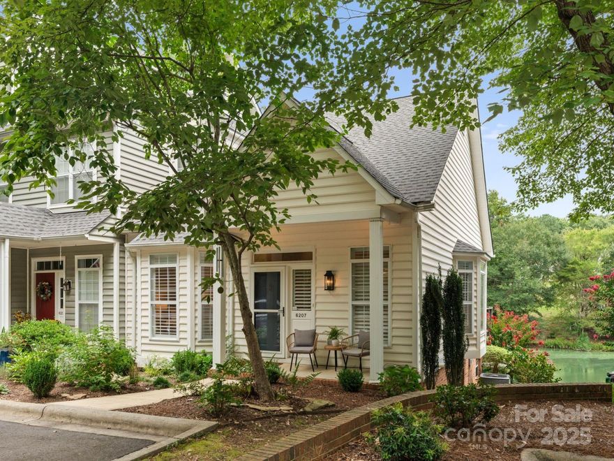 Welcome to the most charming waterfront townhome in Bishops Ridge! This wonderful end unit on a cul-de-sac overlooks a tranquil pond surrounded by trees and nature. This home is filled with natural light, tall ceilings, large windows, true hardwood floors, fresh paint and carpet, and new plantation shutters. The main level has the convenience of the primary bedroom with updated bathroom and walk in closet, dining area, living room with fireplace and kitchen with newly painted cabinets, new backsplash, new fridge and a bright sunny breakfast area overlooking the pond. The living room opens onto a newly painted deck with the best water view in the neighborhood! The walkout lower level has a bonus room that opens onto a covered patio, bedroom, office with closet and close bathroom access, full bath and large laundry room w sink. Carpeted stairs lead to huge walk-in attic great for storage or could be finished for 3rd floor! Amenities include clubhouse, pool, tennis and lawn maintenance.