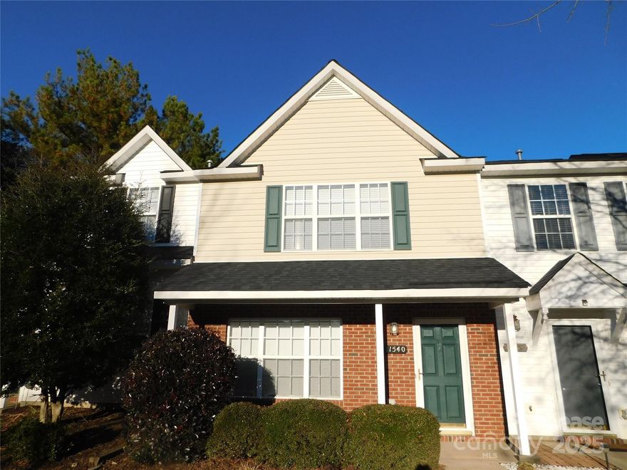 Charming 2-bedroom 2.5-bathroom dual master suite townhome with partial brick front exterior with a front porch to enjoy! The spacious living room is open to the dining area and has a gas fireplace with LVP flooring and fresh paint.  The kitchen has an island and stainless-steel appliances.  The large master suites have spacious closets and bathrooms with double sinks.  The rear of the property features a patio with a tree lined backyard for added privacy.  This home is conveniently located near I-485, Brookshire Blvd, Northlake area, and upcoming Riverbend Center. DON'T MISS IT!!