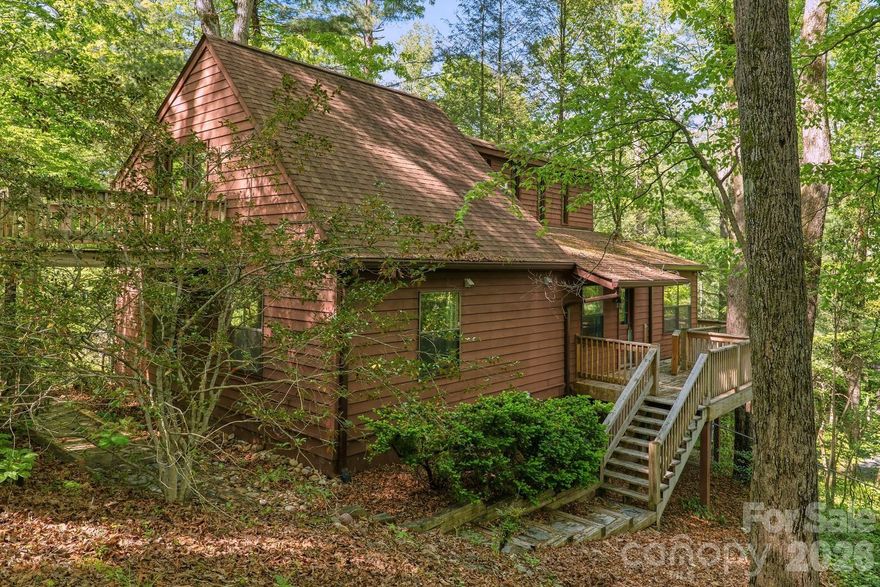 Desirable Terrace Gardens!! This home is conveniently located, with city sewer and city water. The modern cabin-style design features cathedral ceilings, a loft area with a full bath, and multiple decks for outdoor enjoyment.  Situated on a nicely wooded lot, the property offers privacy while remaining just 10 minutes from Main Street, Pardee Hospital, Ecusta Trail, and dining and shopping. The home and an additional lot (see MLS 4373116) are being offered together for $334,000. While the house is a "diamond in the rough," it is priced competitively for a quick sale. Advisory: Heavy smokers lived in the house.