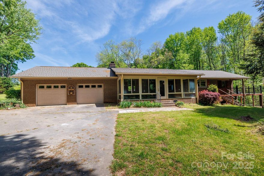 Tucked away on 1.95 acres, this spacious brick ranch offers a warm and inviting layout with an open-concept living room, kitchen & dining area. A cozy den & light-filled sunroom provide even more room to relax and unwind. Thoughtfully designed with storage in mind, the home features an abundance of cabinetry throughout. The expansive primary suite is a true retreat, complete with dual closets and access to the deck. Step outside and enjoy multiple outdoor living spaces including a rear porch, patio, and charming gazebo. Hobbyists and creatives will love the rustic, wired log-style outbuilding with its own front porch—perfect for a studio, workshop, playhouse or personal getaway. In addition to the 2-car attached garage, there’s also a wired 2-car detached garage/workshop (28.2 x 30.3) with an attached lean-to. The unfinished basement is heated and cooled, includes a half bath, and offers additional laundry hookups, giving you even more room to grow. And yes—there’s even a chicken coop!