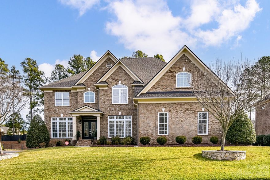 Spectacular Full Brick executive home w/ 3rd floor bonus and incredible private back yard located in the amenity rich neighborhood of BridgeMill. The double door entry welcomes all to this Columbia floorplan featuring high ceilings, gleaming hardwoods on the 1st and 2nd floors, a formal dining room, private study & main floor guest en-suite w/ full bath. The Chef's kitchen w huge island and cabinets galore showcase the amazing counter space w/ tons of natural light. Relax in the back Sunroom overlooking the private back yard oasis, with outdoor patio, beautiful trees and gorgeous landscaping. Spacious Owner's suite features Dual walk-in closets, sitting room & and spa bathroom w/ oversized shower, Jacuzzi tub & dual vanities. 3rd floor bonus w/ additional storage and plumbed for potential 5th bathroom.  This highly social community w/resort-style amenities, clubhouse, two pools, a fitness center, tennis, basketball & volleyball courts and three pocket parks provides something for all.