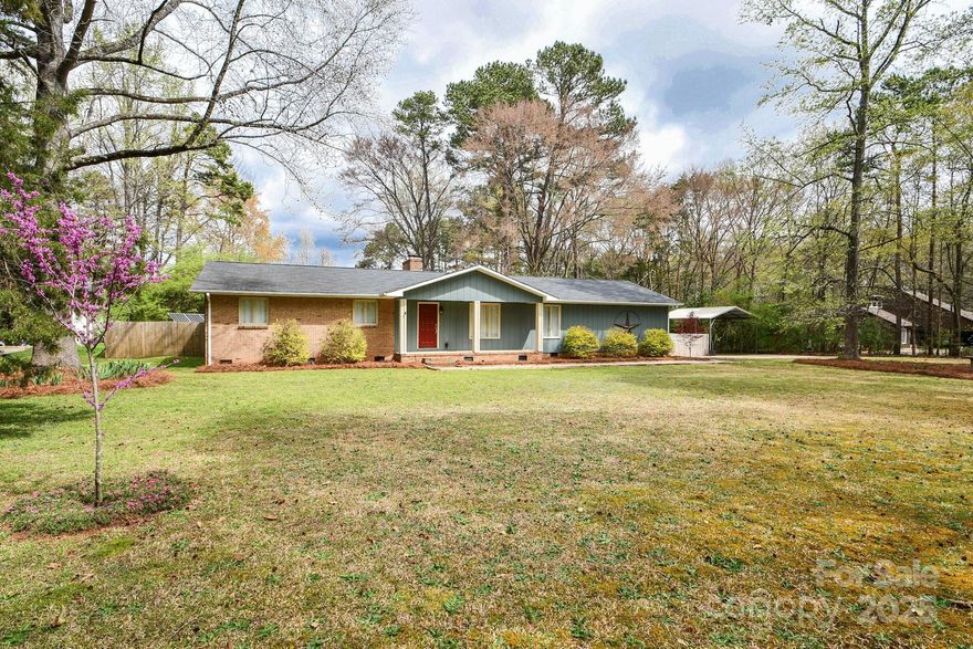 Curb appeal is heavenly for this three-bedroom, two-bathroom ranch home with open-concept living is your lovely private haven. It features a gorgeous sealed floor and heated living square footage area that was previously garage space. This house also has a huge private fenced-in backyard and a spacious one-acre lot. This house and lot is very roomy and provides lots of space for entertainment. Additionally, solar panels were put in place to improve energy efficiency. Come see this one of a kind property TODAY!