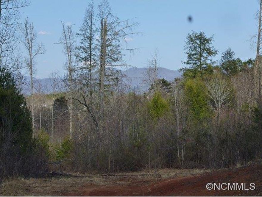 Long range views on rolling acreage that can be subdivided. A peaceful, country setting that comprise of three parcels of land.