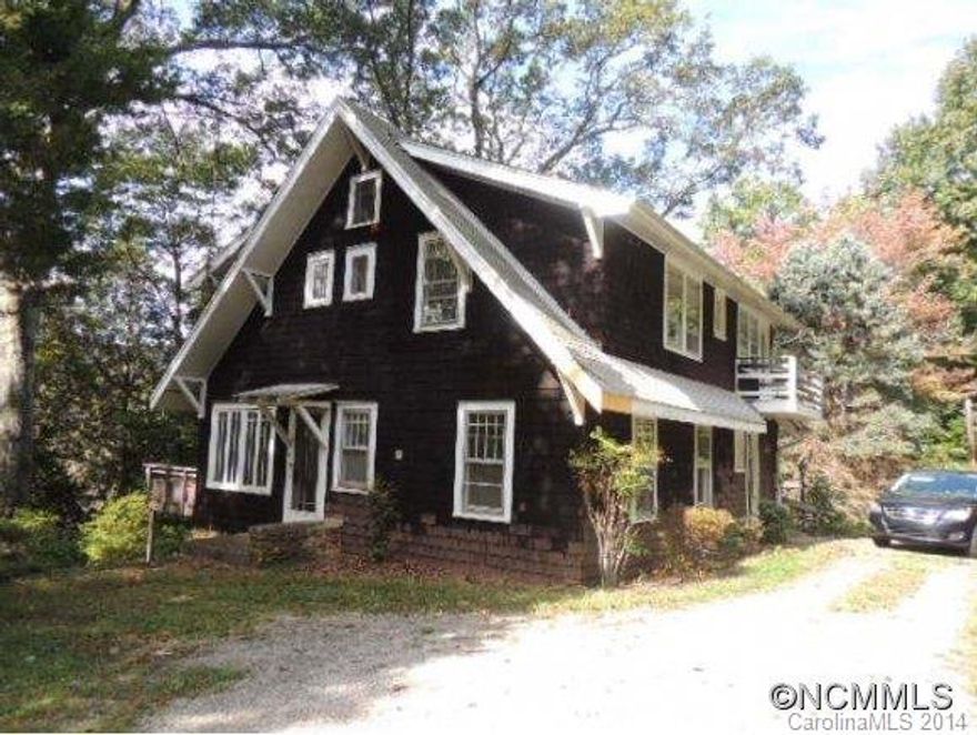 Charming one of a kind older home with cedar shakes.  Hardwood floors throughout.  Stone walls abound on property - separate garden areas give you all the privacy you desire.  Separate two car garage/carport.  Large wrap around deck.  Home needs some work but is liveable as is.