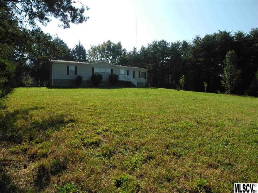 Fantastic location! Just minutes from HWY 321, which ensures a quick commute to Gastonia, Lincolnton or Charlotte. Very private, close to 2 acre lot, level and not restricted. Bring all your hobbies, pets & livestock. Home is in very good condition with easy to maintain laminate flooring throughout the home. Great kitchen with plenty of space to work and prepare great meals! Vaulted ceilings in the living areas makes this home feel even larger! Formal dining room and a huge Living room.