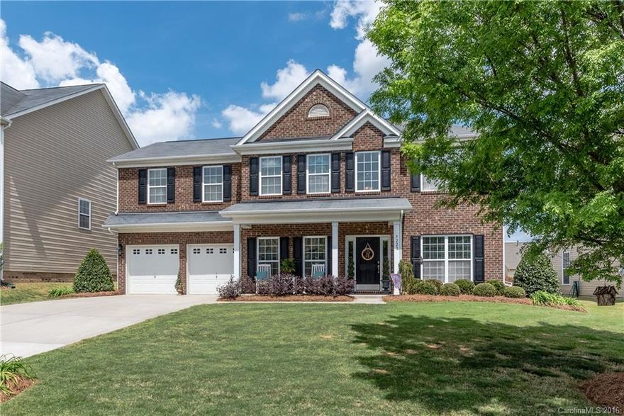 5 Bedroom + Bonus home loaded w/curb appeal includes rocking chair front porch & beautiful landscaping! Main level open plan w/formal Dining w/trey ceiling & moldings, den/office, Guest suite w/full bath! Great Rm w/gas FP flows to Kitchen w/granite counters, eat-in bar + center island, tile backsplash, stainless app's w/fridge, 42-in Maple cabinets, large pantry & breakfast nook! Huge Master w/trey ceiling, elegant bath w/soaking tub, shower, dual vanities. Patio, fenced yard, finished garage!