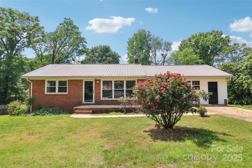 Charming 3 Bedroom 1 Bath Home in Lovely Neighborhood. Beautiful Hardwood Flooring Throughout, Generous Sized Bedrooms, Renovated Ful Bath, Large Kitchen W/ Stunning Knotty Pine Paneling Featuring a Gas Cooktop.

Large Picture Window Brightens the Large Living Room. Enjoy Wonderful Family Gatherings in the Dining Room.

The Enclosed Carport Features Tremendous Storage & Ample Space For a Workshop.

The Property Also Has An Exterior Storage Building in the Rear.