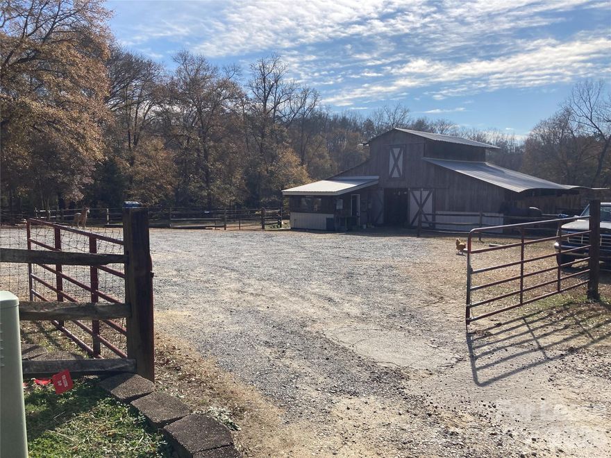 Spacious and comfortable house on a wonderful equestrian estate. While the bucolic location is quiet and serene, it is close to all necessary amenities and easy commute into Charlotte. The entrance is a shared driveway but the house is fenced separately so there is a large private front yard, and lovely views of the sloping wooded lot from the back porch. There has been a thriving business here for many years: riding lessons, boarding and summer camps. The previous owner is willing to share her book of business for a modest fee. The barn houses 18 feeding stalls, easily converted into larger stalls, each with its own electricity and hay storage, plus a lighted arena, tack room, round pen, pasture, riding trail and additional hay storage. If interested in the whole property, including the house, the total rent would be $6000.