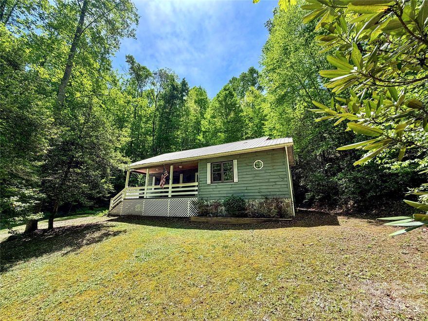 Tucked away at the end of the road, this private 2-bedroom, 2-bath cabin offers the peaceful mountain lifestyle you’ve been searching for. Built in 2006 and surrounded by nature, the home features a durable metal roof and a warm, inviting interior that perfectly complements its wooded setting. Enjoy the charm of a natural spring on the property, creating a serene water feature that enhances the landscape, while a private well serves as the home’s water supply. A separate workshop, heated by a wood stove, provides the perfect space for hobbies, storage, or year-round projects. With end-of-road privacy, you’ll appreciate the quiet seclusion while still being conveniently located to both Cherokee and Sylva for dining, shopping, and local attractions. Whether you're looking for a full-time residence, vacation getaway, or investment opportunity, this cabin delivers comfort, functionality, and the beauty of mountain living. Call today for your private showing!