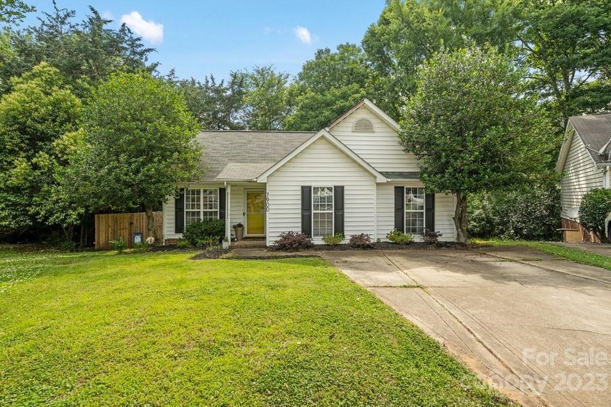 Cute as a button in popular Starmount Forest! Nestled in a cul-de-sac on nearly a quarter acre lot, & tastefully updated, this home is move in ready! You'll be greeted with tons of natural light in the large living room, accented with a cozy gas fireplace & vaulted ceiling. The dining area gives you a luscious back yard view through the glass sliding doors. All stainless steel appliances & white cabinetry complete the fresh look of the galley style kitchen which includes a pantry. Down the hallway you'll pass the laundry room & 2 large guest bedrooms which share a bathroom. The primary suite is spacious with two walk-in closets & a vaulted ceiling for even more natural light. Outside there is a great deck- perfect for entertaining guests - with steps down to the newly fenced flat back yard. Stylish vinyl plank flooring throughout, neutral paint in living areas & updated light fixtures. Walk to Starclaire Swim Club, separate membership, and to the stunning Sugar Creek Greenway system.