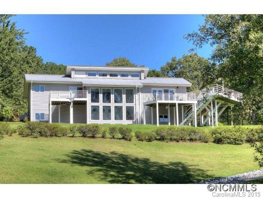 Fantastic contemporary with light, bright rooms, open floor plan, soaring ceilings and large multi-purpose room in lower level used as media room. Passive solar sunroom, contemporary cabinets in kitchen and baths. Large deck with retractable awning and great view of  beautiful yard and mountain view. Includes 32x64 building with 1 bed, 1 bath apartment and storage for big toys. This is a one of a kind property.